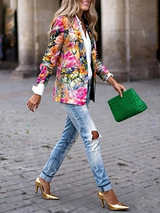 Women's slim fit floral blazer with colorful print styled with light blue ripped jeans