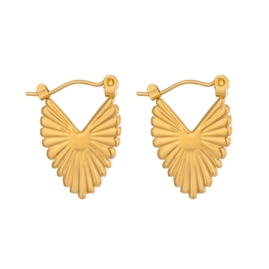 Macro detail of gold geometric heart hoop earrings with radiant textured metal finish