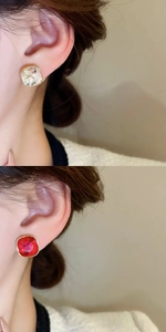 Close-up of square cut crystal earrings with gold plating in red and clear styles