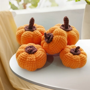 Set of five handmade crochet pumpkins in orange and brown for autumn home decor