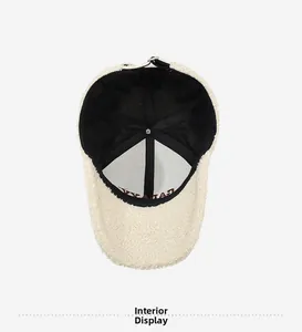 Detail view of the warm teddy fleece baseball cap interior with adjustable strap buckle