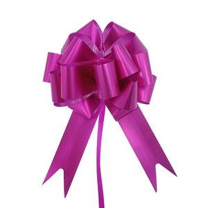 Close-up of a 3D spherical purple gift bow with metallic finish and trailing ribbons