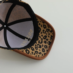 Close-up interior detail of kids leopard print baseball cap with Boston embroidery