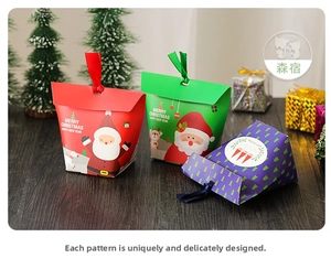 Close-up of festive Christmas paper gift bags with Santa patterns and silk ribbons
