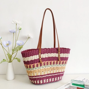 Rainbow striped straw tote bag with brown leather straps for beach and summer vacations