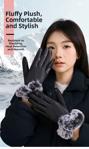 Close-up of winter women's leather gloves with fluffy faux fur cuffs in a snowy setting
