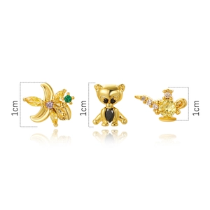 Detail of three 1cm gold animal stud earrings with colorful zircon stones on white base