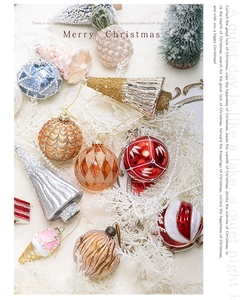 Flat lay of festive Christmas glass ball ornaments with glitter and embossed textures