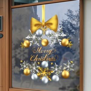 Golden and silver Christmas snowflake window stickers in a round wreath layout design