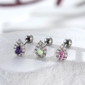 Titanium steel teardrop earrings with purple, iridescent and pink stones on white stone
