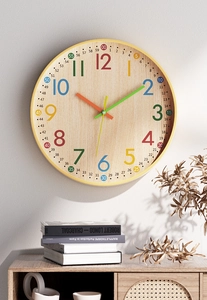 Detail of 12-inch colorful educational wall clock with wood texture and rainbow numbers
