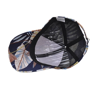 Deep blue baseball cap with colorful tropical leaf prints and internal lining structure