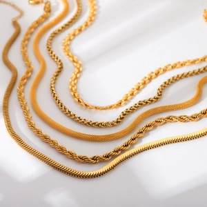 Set of gold stainless steel chains including snake and rope link necklace styles