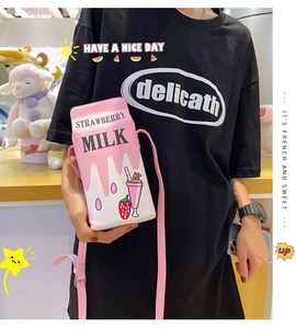 Creative strawberry milk box crossbody bag styled with a casual fashion look