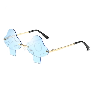 Fashionable rimless mushroom shaped sunglasses with light blue lenses and gold metal frames