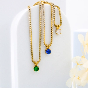Titanium steel birthstone necklaces in green, blue and white on gold tennis chains