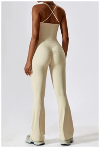 Detail of high-waisted flared yoga pants with scrunch butt design and crisscross back top