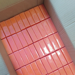 Bulk orange Kojic Acid Soap bars neatly arranged in a shipping box showing large quantity