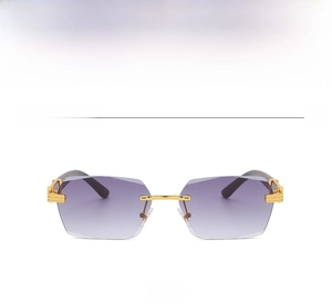 Close-up of gold metal sunglasses with wood grain temples and grey gradient lenses