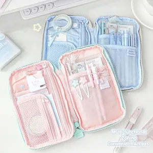 Multi-compartment pastel fabric stationery storage bag in pink and blue versions