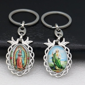 Religious keychain set featuring Our Lady of Guadalupe and St. Jude oval metal pendants
