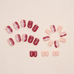 Short red glitter festive press-on nails with white bow French design for Christmas