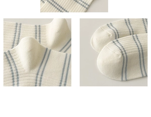 Detailed close-up showing the blue striped knit texture and seamless toe of the cotton sock