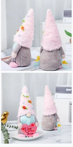 Detailed close-up of a Mother's Day faceless gnome doll holding a pink I LOVE MOM heart