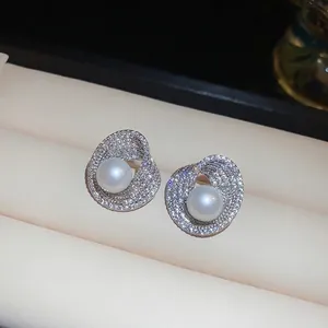 S925 silver pearl stud earrings with zircon spiral design in a luxury jewelry box