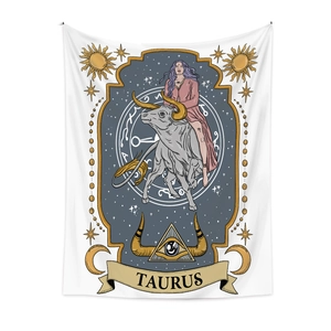 Detail of Taurus zodiac tapestry featuring a woman on a bull with golden celestial motifs