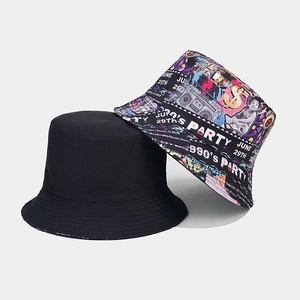 Detail view of reversible bucket hat showing classic 90s party tape graffiti print