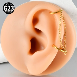 Macro view of G23 solid titanium gold double chain ear cartilage piercing on model