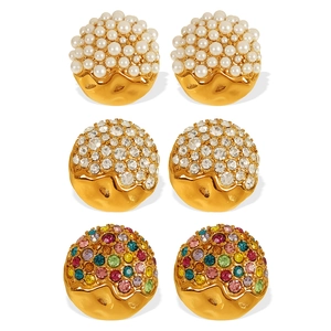Three pairs of elegant gold heart earrings with white pearls and sparkling crystals