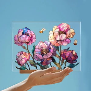Macro view of floral acrylic desk ornament with bees and elegant wooden base