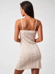 Close-up of adjustable straps and floral knit fabric on the back of a slim summer dress