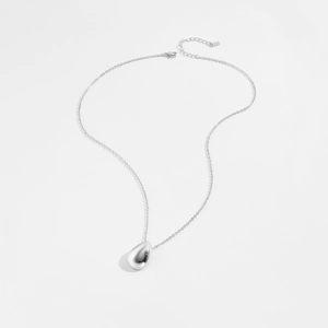 Detailed close-up of a silver water drop pendant necklace with an adjustable link chain