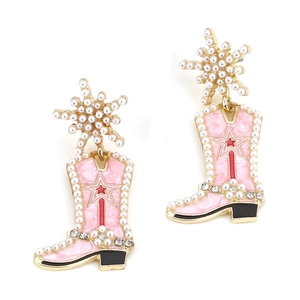 Detail of pink cowboy boot earrings with faux pearl stars and red star accents