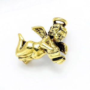 Detailed close-up of a golden vintage reading angel brooch with polished alloy texture