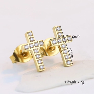Detailed macro view of 6mm gold stainless steel cross stud earrings with cubic zirconia