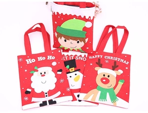 Detailed view of four felt Christmas gift bags with Santa, reindeer, and snowman designs