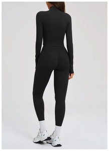 Rear view of black yoga set featuring V-shaped waist leggings and pockets for phone