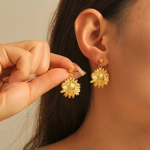Elegant gold sunflower earrings made of titanium steel with detailed petal textures