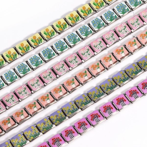Italian charm bracelet with floral enamel patterns on modular stainless steel links