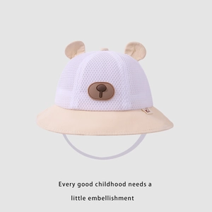 Detail of baby sun hat featuring breathable white mesh fabric and cute 3D bear ears