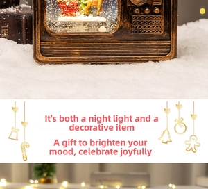 Close-up of vintage TV music box showing Santa scene and floating glitter sparkles