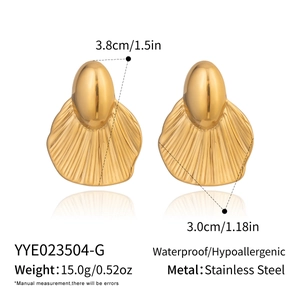 Detail showing gold geometric leaf earrings in stainless steel with waterproof features
