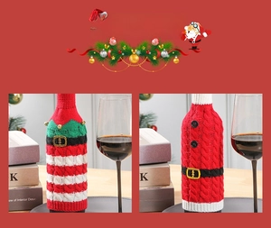 Detailed view of striped knit Christmas wine bottle covers with festive bell decorations
