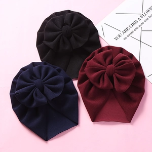Detail view of baby knot headbands in black, navy and burgundy with large bows