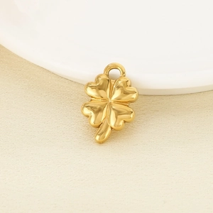Macro shot of gold-plated four-leaf clover pendant in 18K stainless steel for DIY jewelry