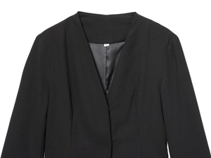 Detail of the V-neckline and woven fabric texture on a black blazer dress